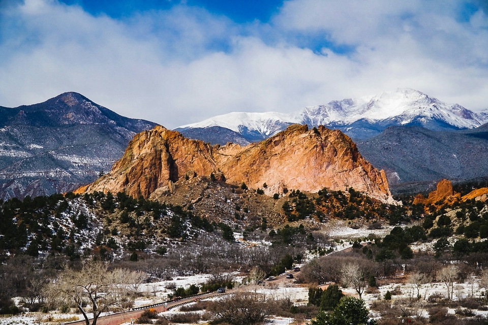 Garden of the Gods in winter, with snow on the mountains behind, in Colorado Springs